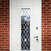 Фото входных дверей с ковкой и стеклом